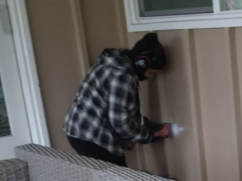 Professional electrician installing an exterior outlet in Perryville