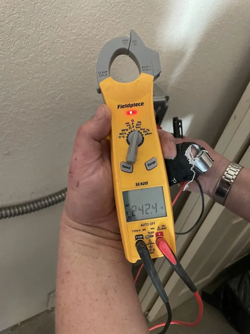 Voltage testing with clamp meter during Outlet Installation in Perryville